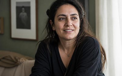 Woman smiling naturally in soft window light